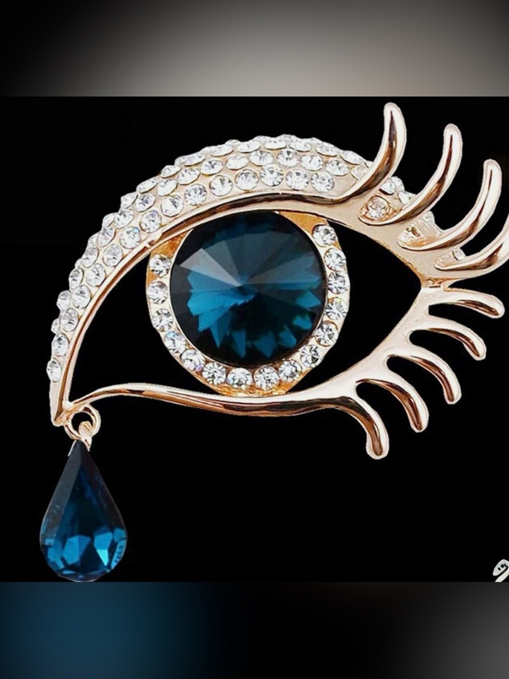 Elegant Gold-Tone Blue Crystal Eye Brooch